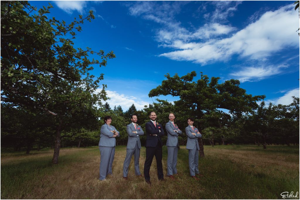 groomsmen pose at Merridale Cidery orchard