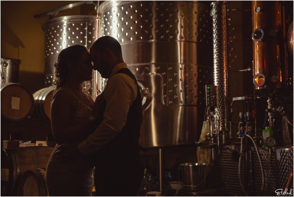 Night shot of couple in distillery at Merridale Cidery