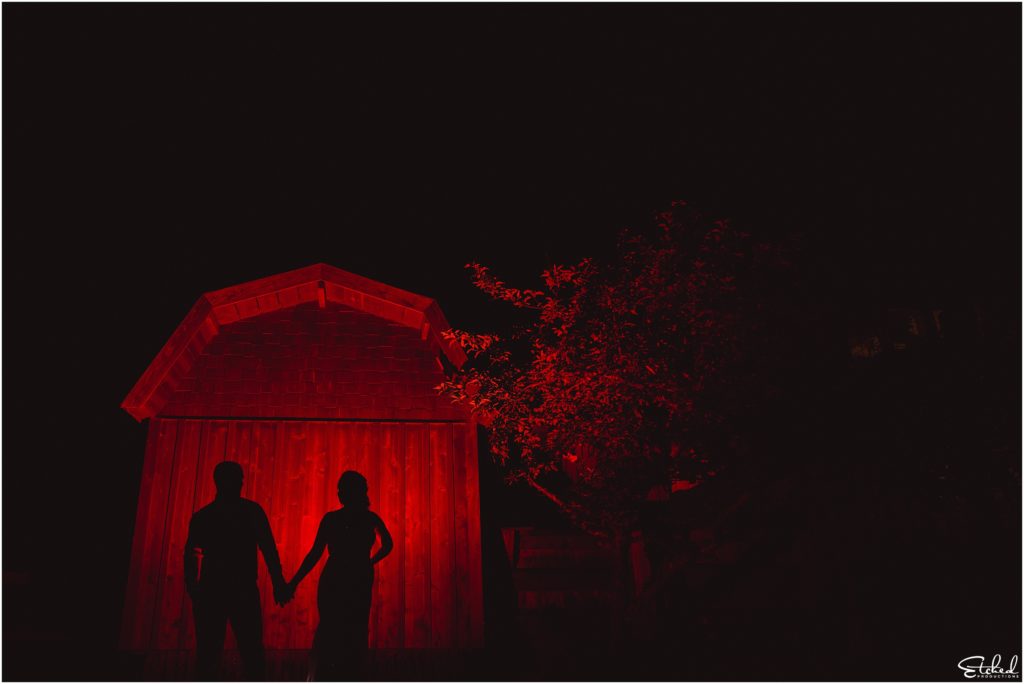 silhouetted night shot of Merridale Cidery wedding couple